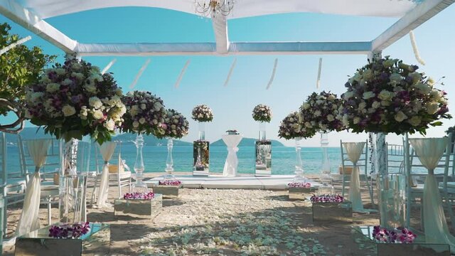 Decoration Wedding setup with Bouquets tropical beach and blue sky.