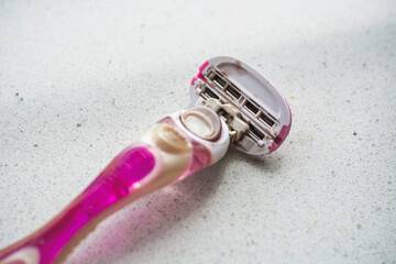 Pink well used dirty old rusty ladies razor shaver. Personal hygiene and unsanitary concept