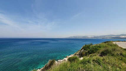 Best panoramic view of sea in the middle east region. Sunny day at the ocean with clear water and smooth waves. Rocky coast. Travel destinations to enjoy with family and friends. Road trip. Fun