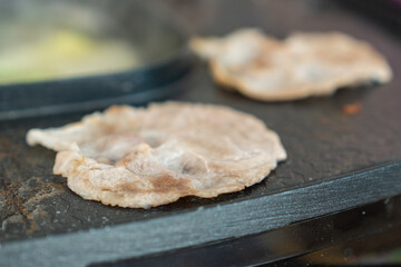 Close-up Sliced Pork in Non-stick grill pan, Korean BBQ.