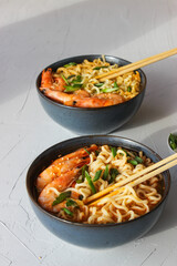 Ramen soup with prawns and green onions.