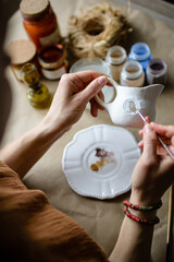 Fototapeta na wymiar Hand-painting homemade ceramic dishes.