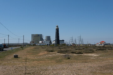 The Old Lighthouse and nuclear power station in the background at the Dungeness Headland, Kent,...