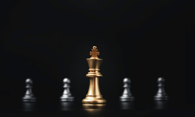 Golden of king chess in front of silver pawns chess for leadership concept.