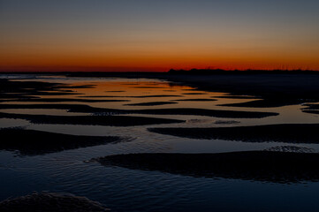 Fototapeta premium Sunset over Tidal Pools on Beach