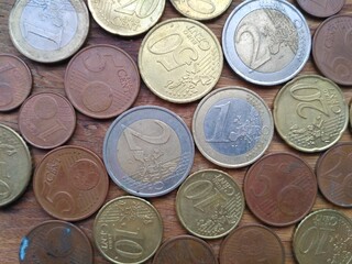 Coins on tne wooden background