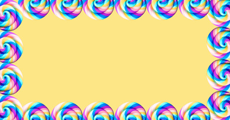 Yellow background with multicolored lollipops with copy space