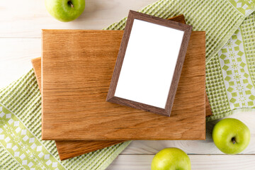 green apples empty wooden cutting board