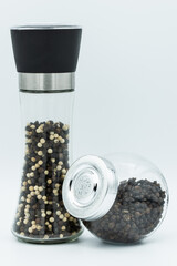  paper mill contained both of black pepper and white pepper isolated on white background