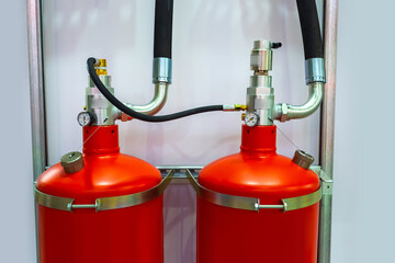 Fire-fighting equipment close-up. Two red stationary fire extinguishing balloons. Fragment of anti...