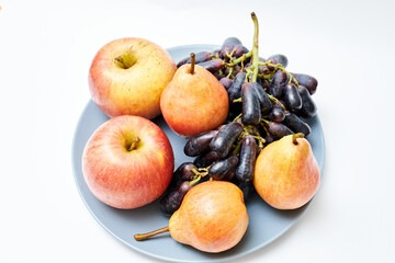 Naklejka na ściany i meble plate with grapes, apples and pears
