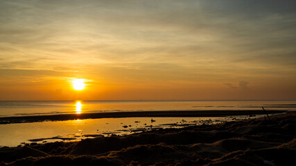beautiful orange sunrise in the sea at Surat Thani, Thailand