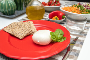 Nutritious dishes prepared with mozzarella salad and tomatoes. Natural and healthy ingredients of the Mediterranean diet: olive oil, cereals, peppers, vegetables, fruit and cheese. Farmers products