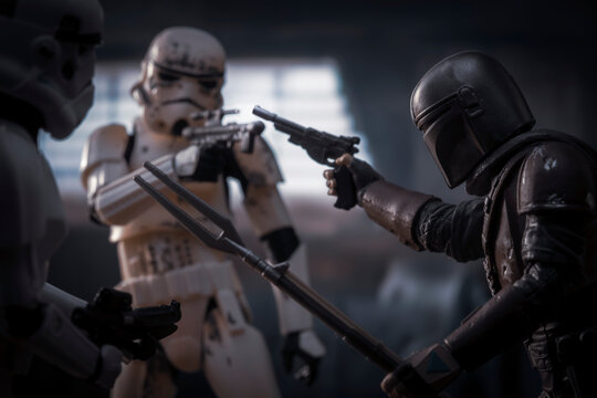 NEW YORK USA, APRIL 25 2021: Scene from Disney Plus Star Wars The Mandalorian, Din Djarin fighting remnant Stormtroopers  - Hasbro action figures