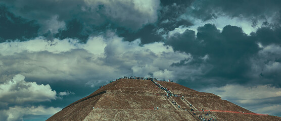 Stormy day at Teotihuacán Mexico with dark blue clouds.