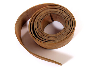 Leather Strap Belt, Rolled. Isolated on white background.