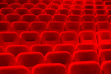 Obraz premium An empty cinema room with red velvet seats. Empty cinema.