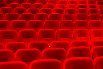 An empty cinema room with red velvet seats. Empty cinema.