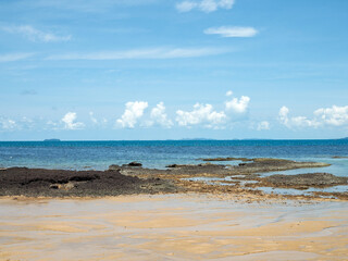 Beautiful blue sea beach. Against the sky and white clouds.