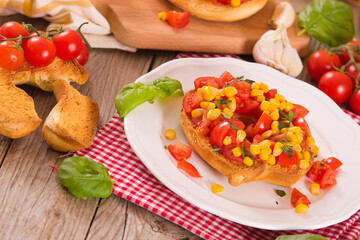 Friselle with tomatoes and mais. 