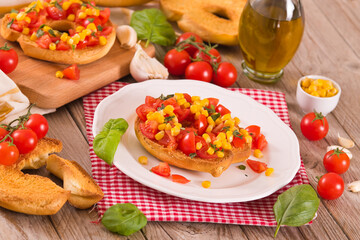 Friselle with tomatoes and mais. 