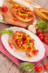 Friselle with tomatoes and mais. 