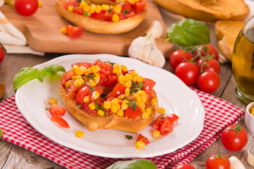 Friselle with tomatoes and mais. 