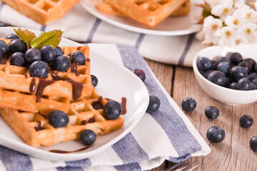 Waffles with blueberries and chocolate cream.