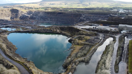 Large limestone quarry in Clitheroe, Ribble valley. Deep excavation quarrying for rocks