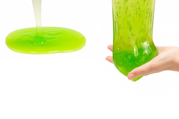 Green slime toy in woman hand isolated on white.