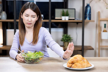 Asian woman choose to eat vegetable salad, Eating good for good health.