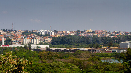 Fototapeta premium Landscape on top of a mountain showing the buildings and houses of the city