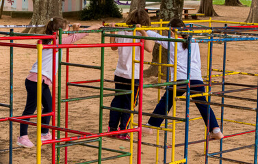Fototapeta na wymiar Children playing on the school playground in central city