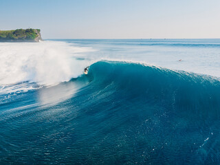 Obraz premium Aerial view with surfing on ideal wave. Blue perfect waves and surfers in ocean