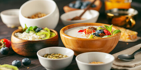 Healthy breakfast set with yogurt, berries, coffee and granola. 