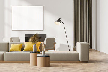 Contemporary white living room interior with fireplace, sofa, armchairs. Big poster template mockup...