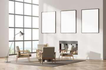 Contemporary white living room interior with fireplace, armchairs. Three posters in a row template...