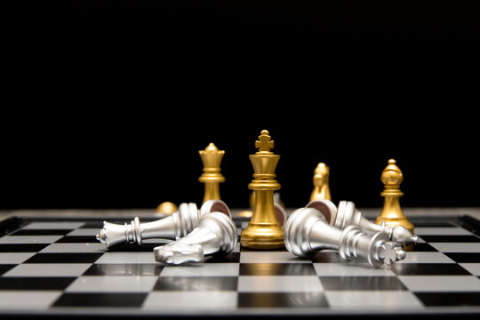 golden king and queen knight and bishop is last standing in the chess board concept of successful business leadership