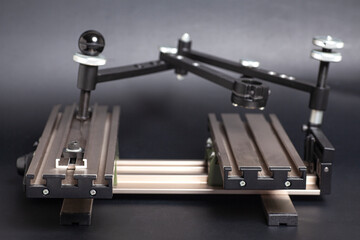 Engraving device pantograph on black background