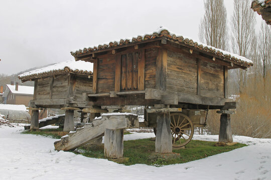 Detail of traditional granaries under the snow in the town of Prioro, Leon Spain