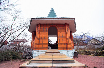 beautiful brick gazebo in the backyard