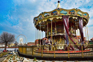 colorful carousel and ferris wheel in Gdansk, Poland 