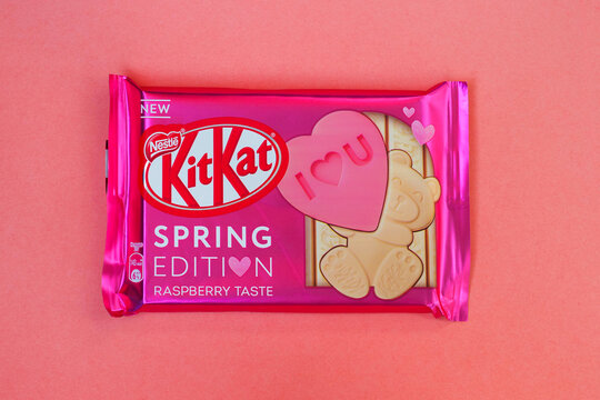 Moscow, Russia - March, 2021: Kit Kat with raspberry taste, spring edition. KitKat chocolate bar on pink background, top view. Text: I love you