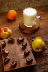 Iftar food for Ramadan fasting dates, fruits and ayran.