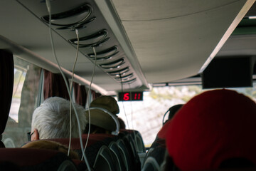 Bus passengers headphones chargers free cables. Modern autobus