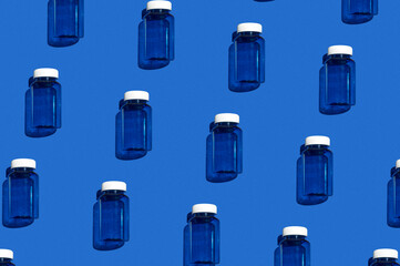 Medicine jar pattern. Fashionable blue medicine jar on a bright blue background. Colorful pattern. View from above