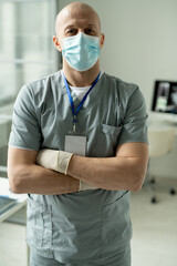 Fototapeta na wymiar Portrait of satisfied surgeon with crossed arms