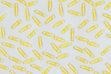 Paper clips pattern in trendy color. Minimal flat lay.
