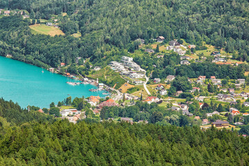 Naklejka na ściany i meble Aerial view to surroundings of Worthersee lake in Austria, summertime travel destination