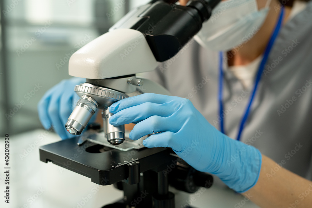 Poster Adjusting microscope slide in laboratory